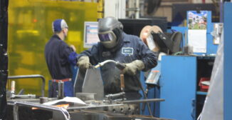 Manufacturing compliance software tracking energy consumption and production metrics in midmarket factory