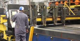Manufacturing shop floor operator at CNC cutting machine